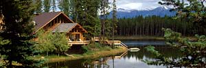 handcrafted log cabin on tranquil mountain lake