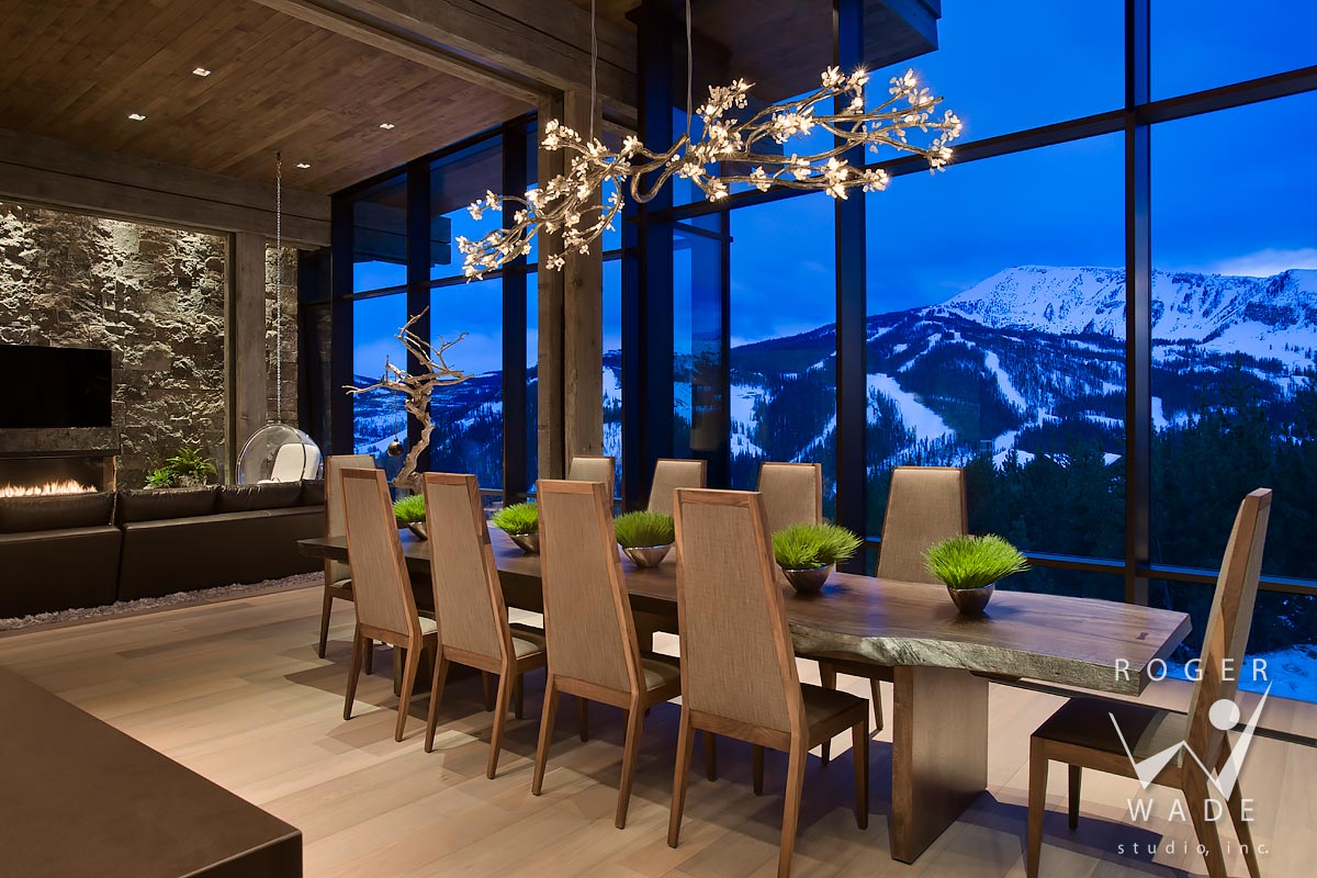 modern interior photograph, dining area looking out windows to mountain view at twilight, yellowstone club, mt