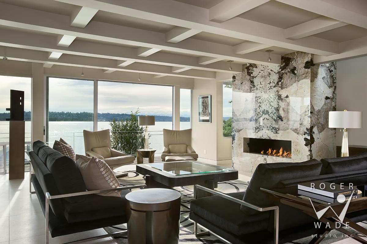 modern interior design photography, living room toward fireplace and deck with view of lake washington, kirkland, wa