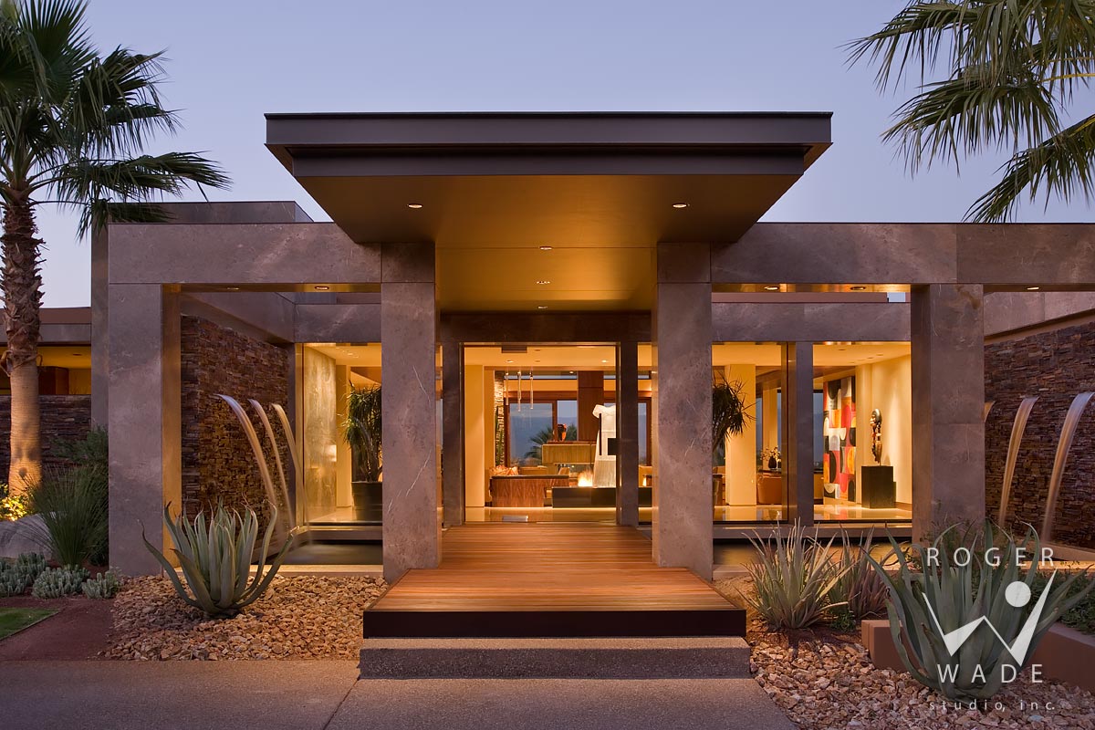 photo of contemporary architecture, front entry with water fountains at twilight, palm desert, ca