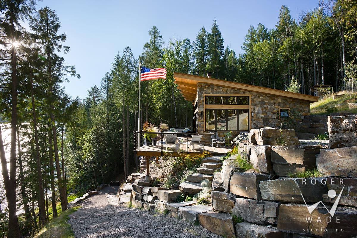 contemporary cabin photo, side elevation showing deck and stone steps, looking out to lake view, swan lake, mt