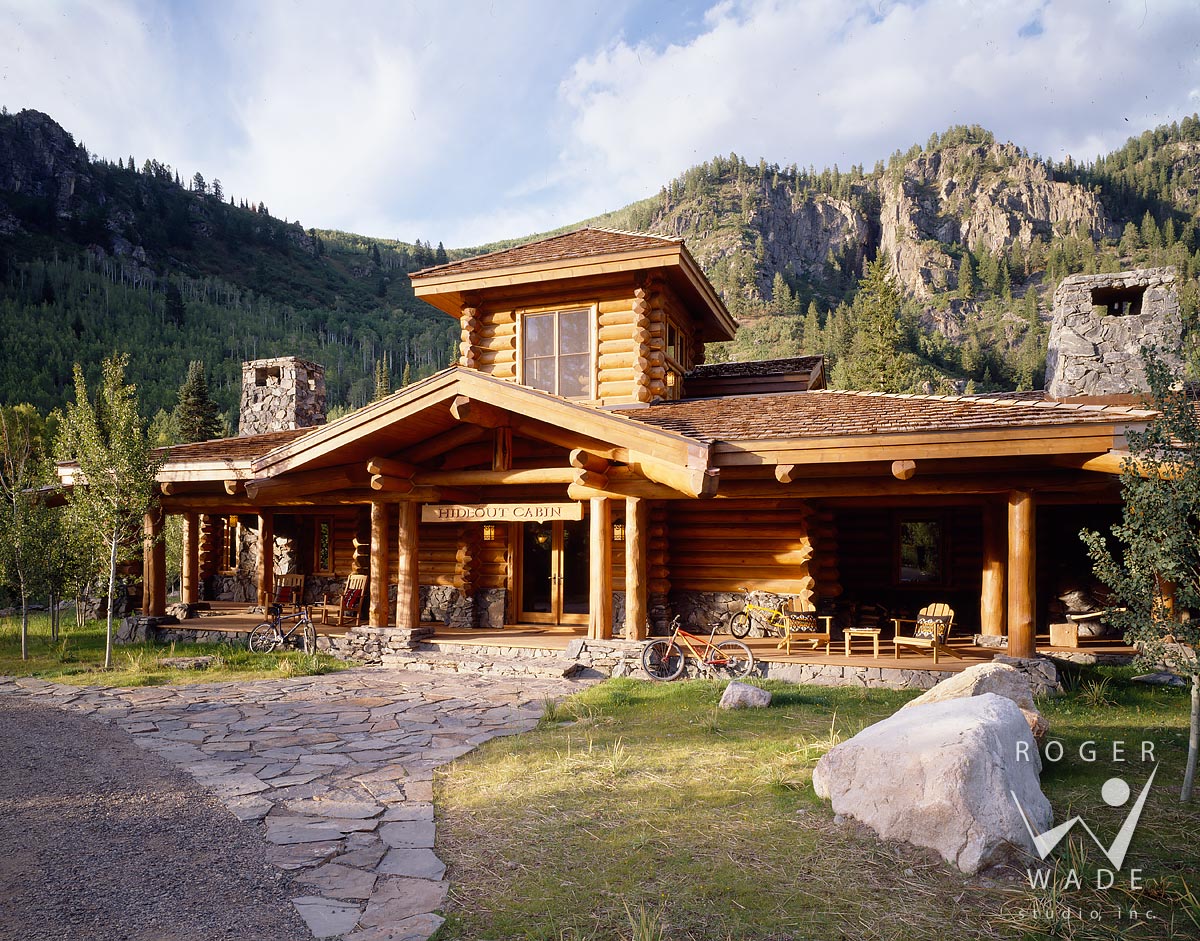 log cabin image, front elevation with mountains in background, steamboat  springs, co