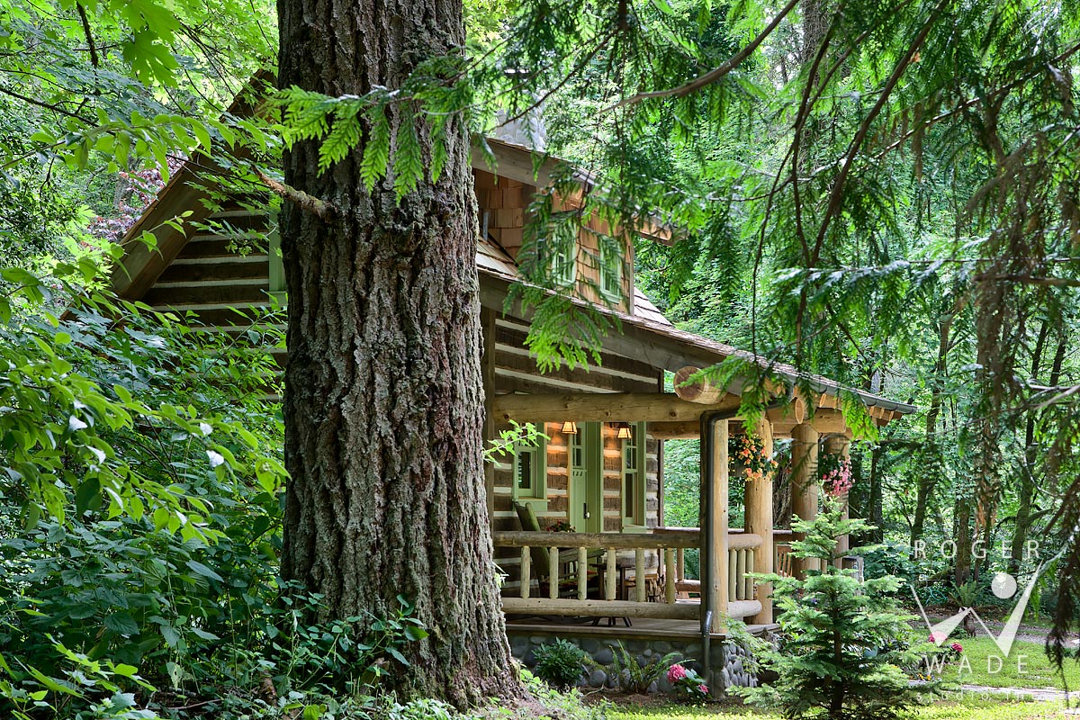 log cabin photo, porch view through trees, port orchard, wa