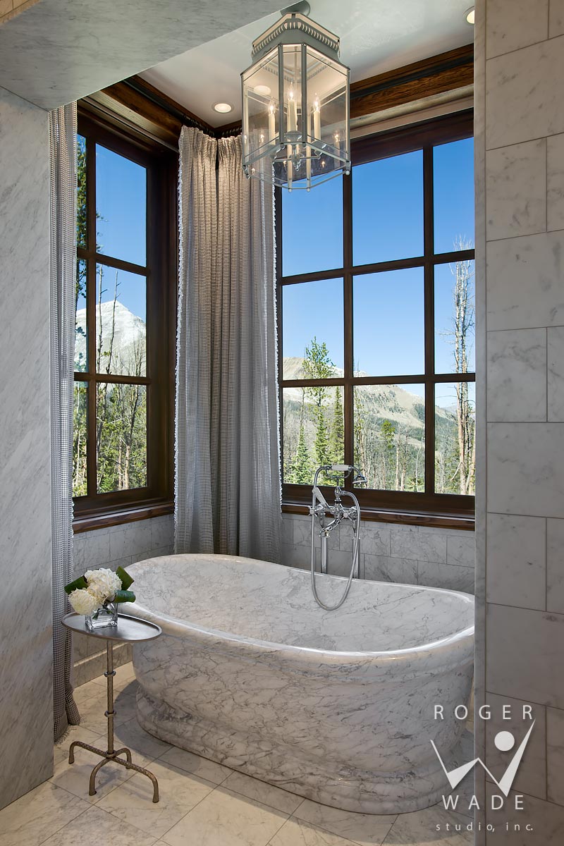 traditional interior design stock image, marble carved tub in luxury bathroom, yellowstone club, mt