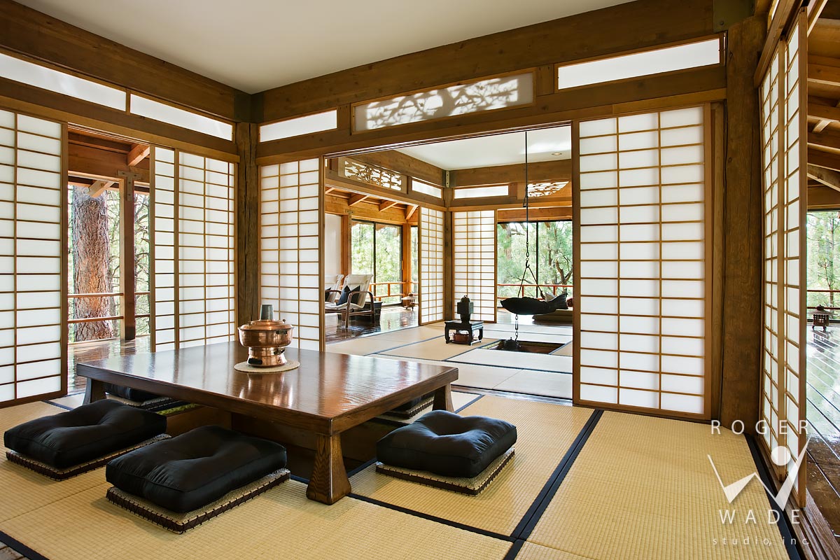 traditional japanese interior design photography, pavillion looking toward engawas with dining area in foreground, forest lakes, az