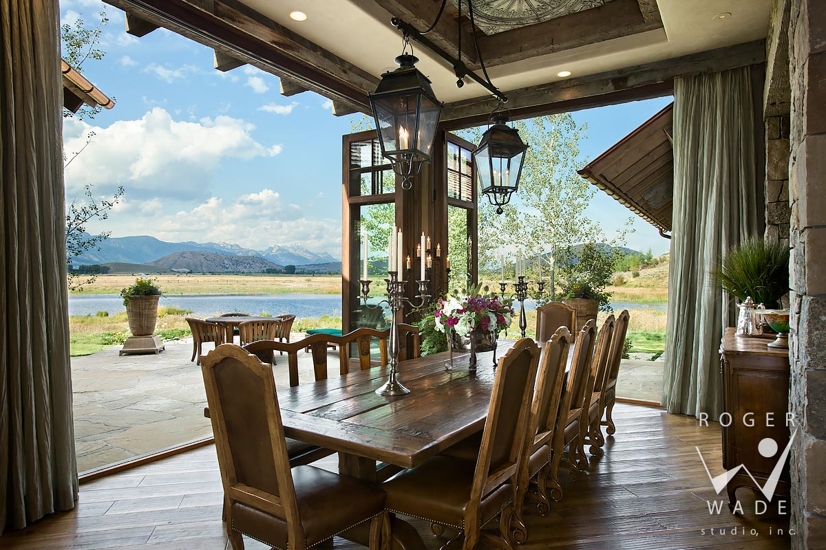 traditional interior design photo, dining room looking out sliding glass walls to ranch view, jackson, wy
