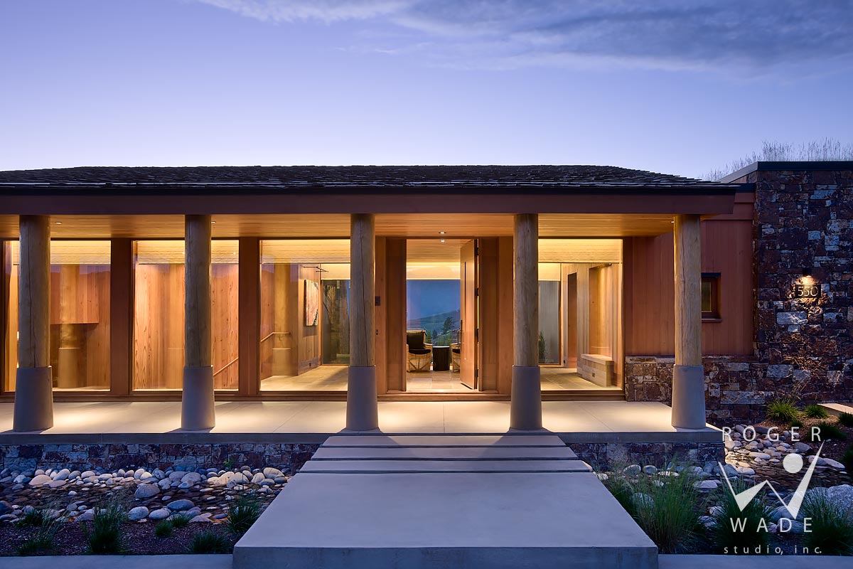 image of modern rustic architecture, front entry at twilight, jackson, wy