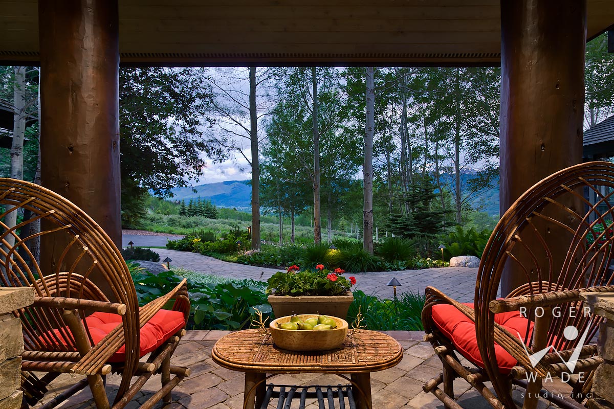 log home photography, front patio looking out to garden view at twilight, jackson, wy