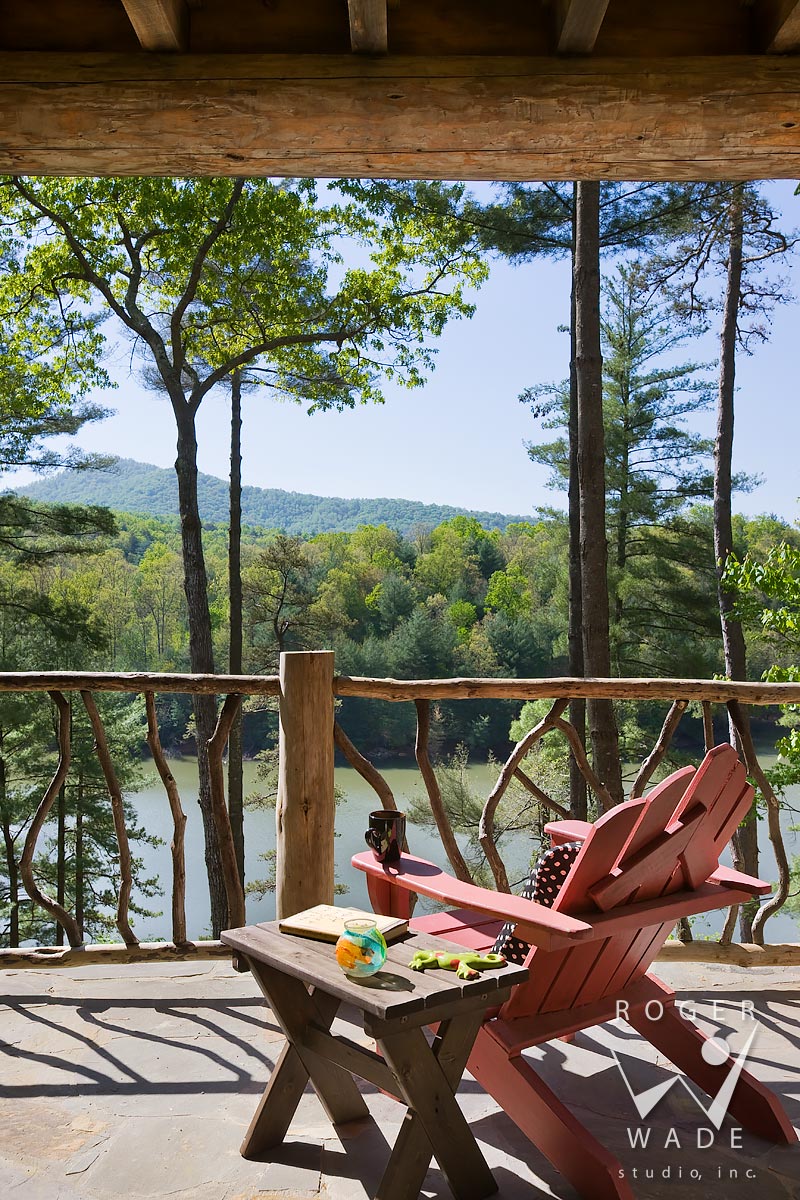 log cabin stock photography, deck with andirondack chair and log railing, looking out to lake view, blue ridge, ga