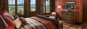 rustic master bedroom with red walls, luxury Montana ranch